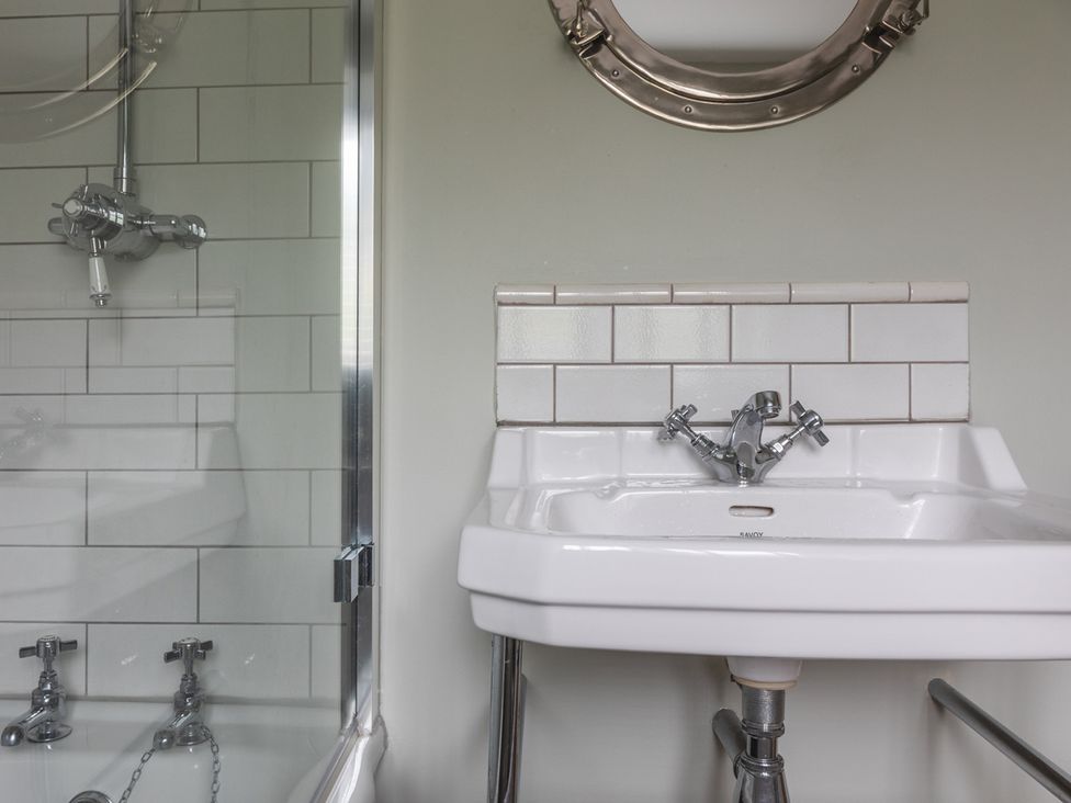 A bathroom with a shower and sink at George House in Dartmouth