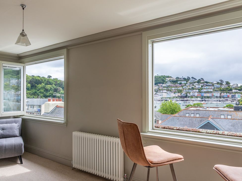 A living room with a sofa and a chair at George House in Dartmouth