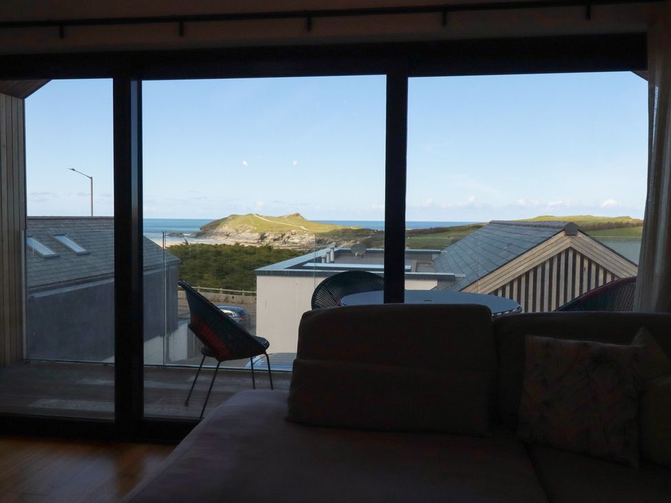 A living room with a view of the ocean at Porth Cove in Porth