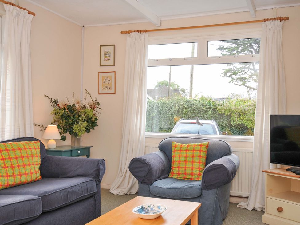 A living room with a sofa and armchair at Avoca in Rock