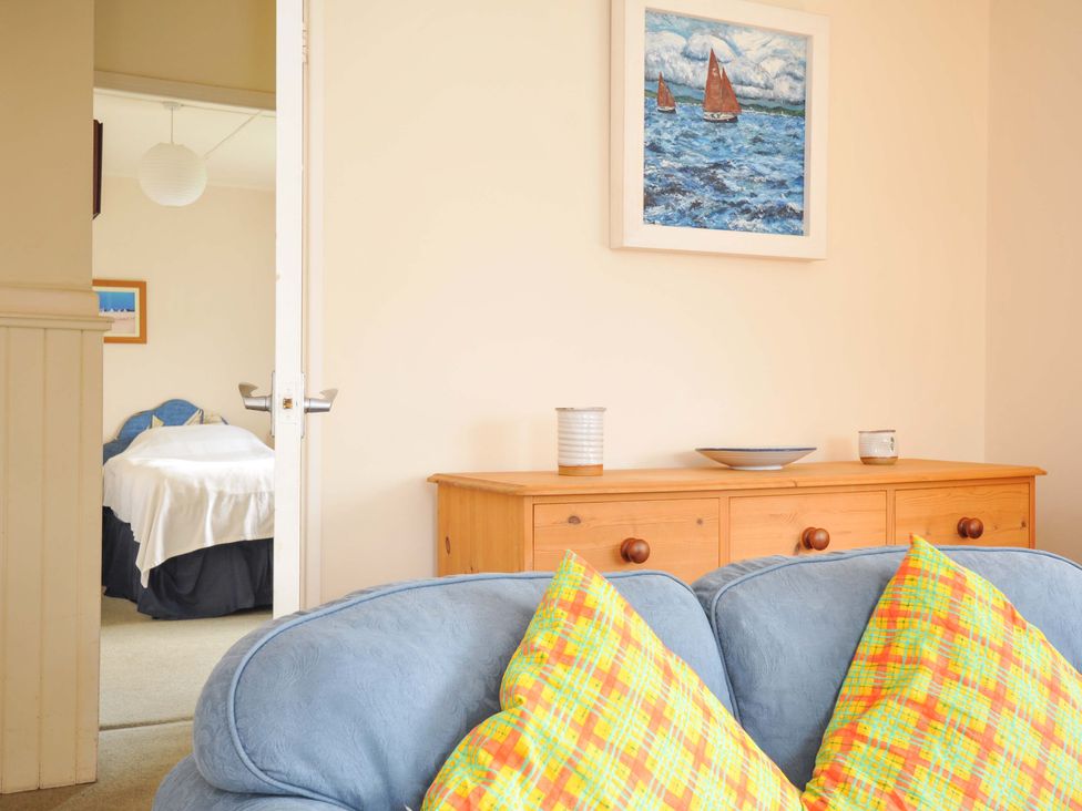 A living room with a sofa and cushions at Avoca in Rock