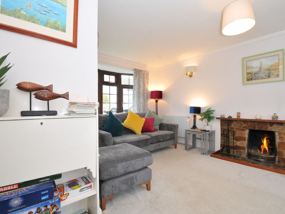 A living room with a sofa, fireplace, and decorative objects at Hazelhurst, Rock