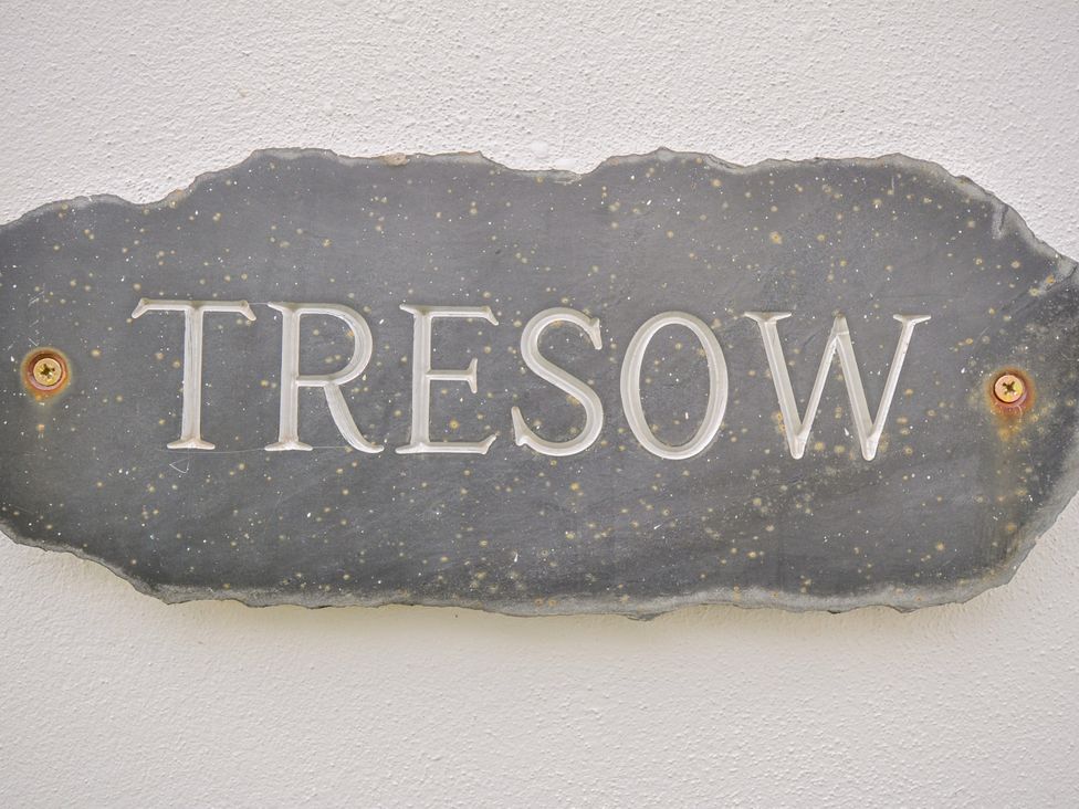 A sign reading Tresow mounted on a wall at Tresow in Rock