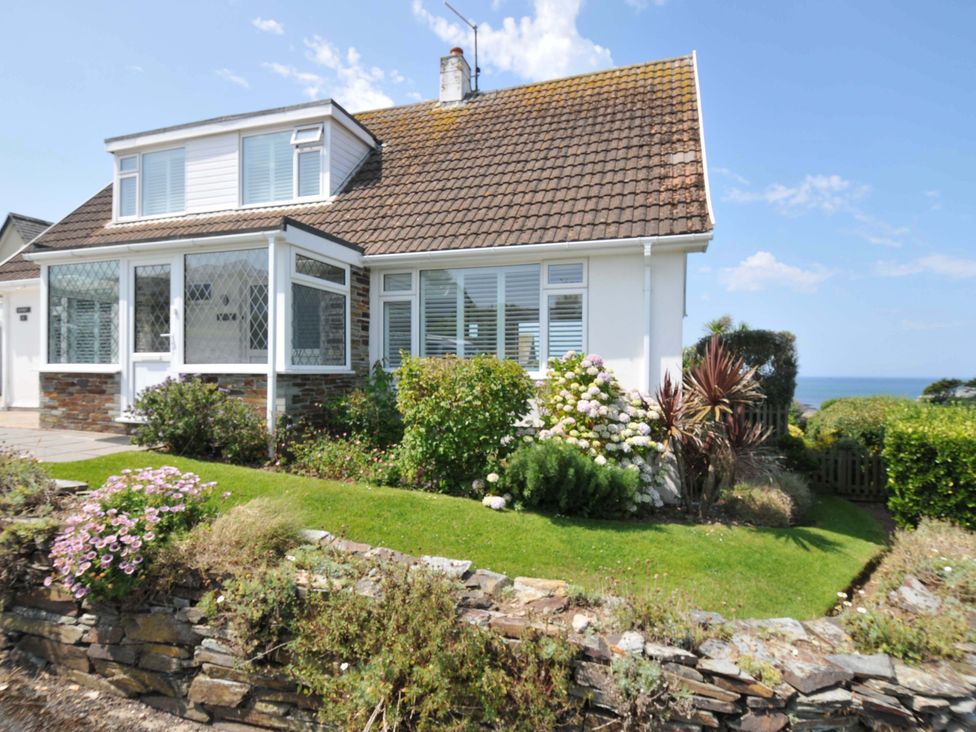A house with garden and flowers at Sunset in Polzeath