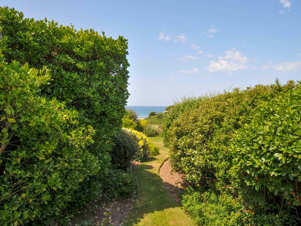A garden path leading to the sea view at Sunset in Polzeath