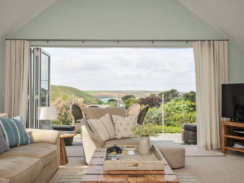 A living room with a sofa and coffee table at Farlands, Daymer Bay
