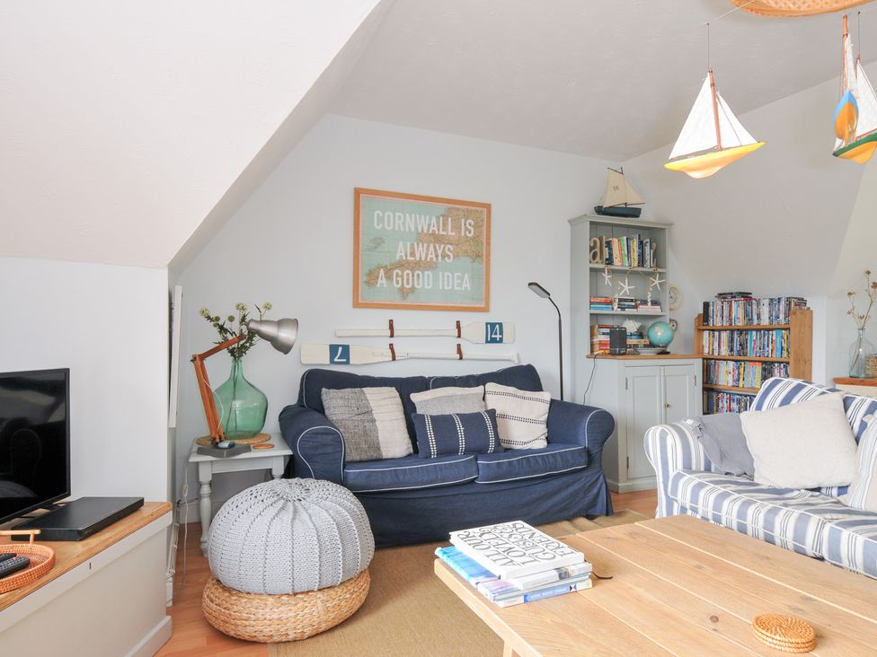 A living room with a blue sofa and wooden coffee table at Rocklings in Rock