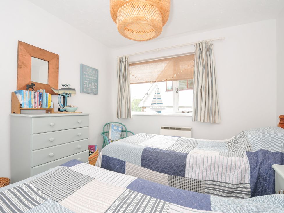 A bedroom with two beds and a dresser at Rocklings in Rock