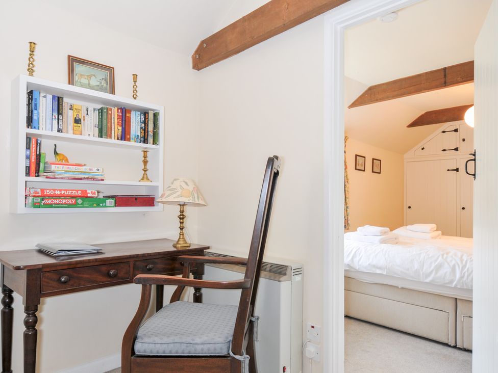 A study room with a desk and bookshelf at Mill Pond in Rock