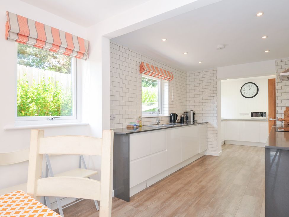 A kitchen with windows and appliances at Porthilly Brook in Rock
