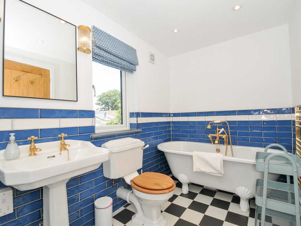 A bathroom with a bathtub and sink at Porthilly Brook in Rock