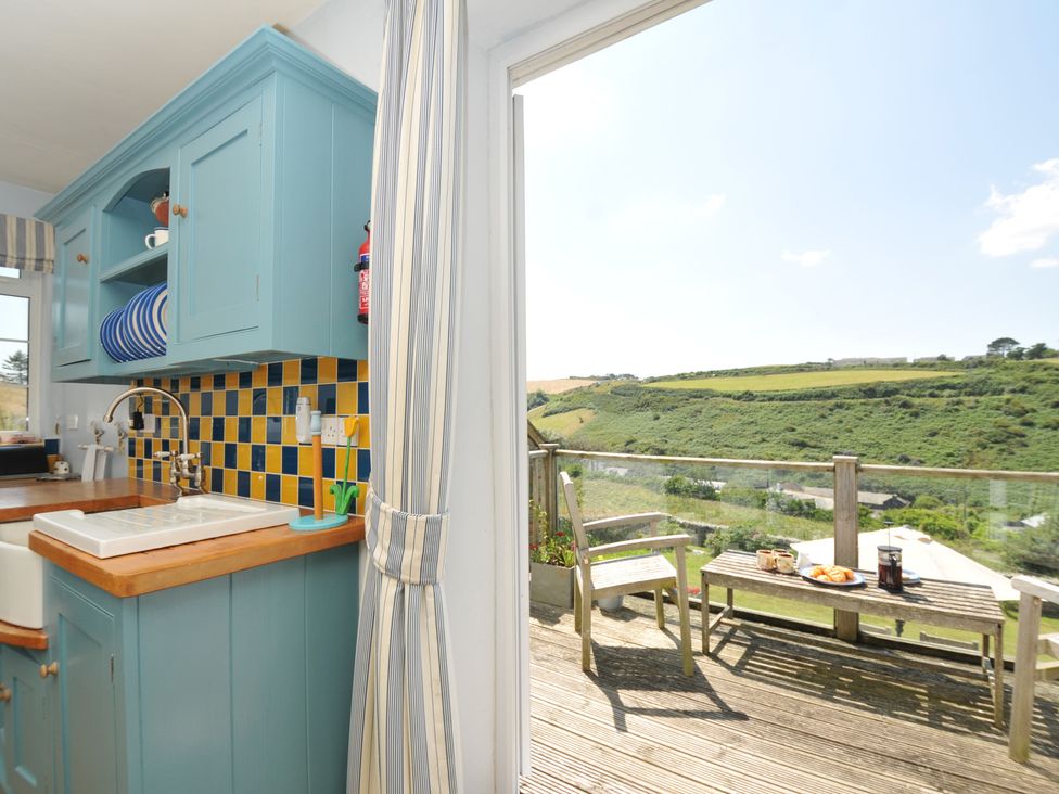A kitchen with a sink and counter at Cartway Cove in Port Isaac