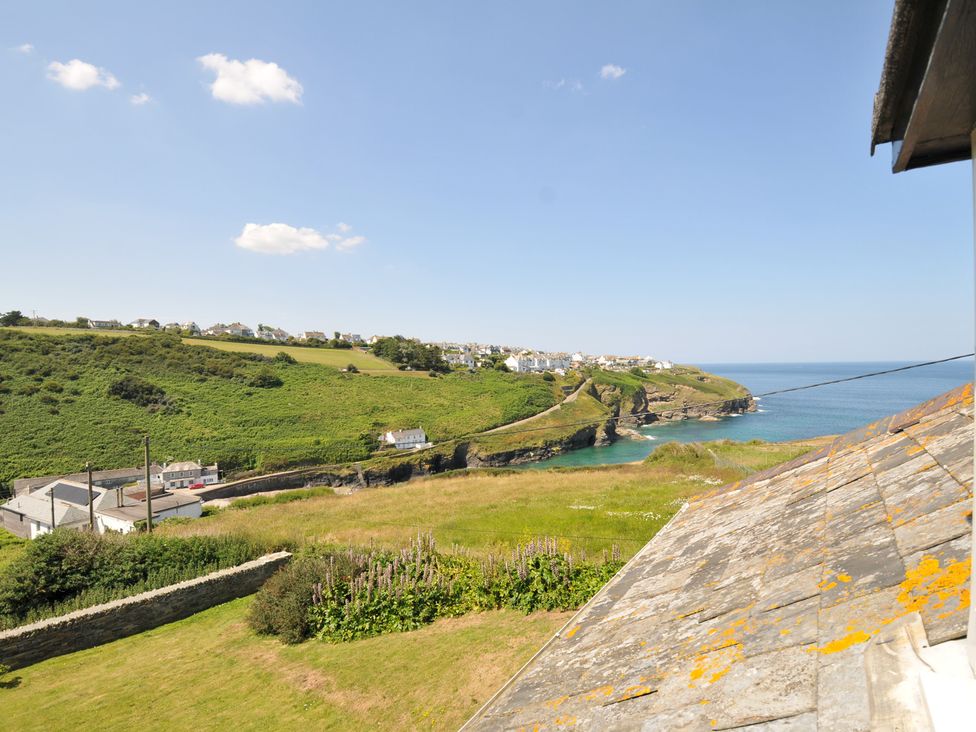 A scenic view of the coast and hills at Cartway Cove, Port Isaac