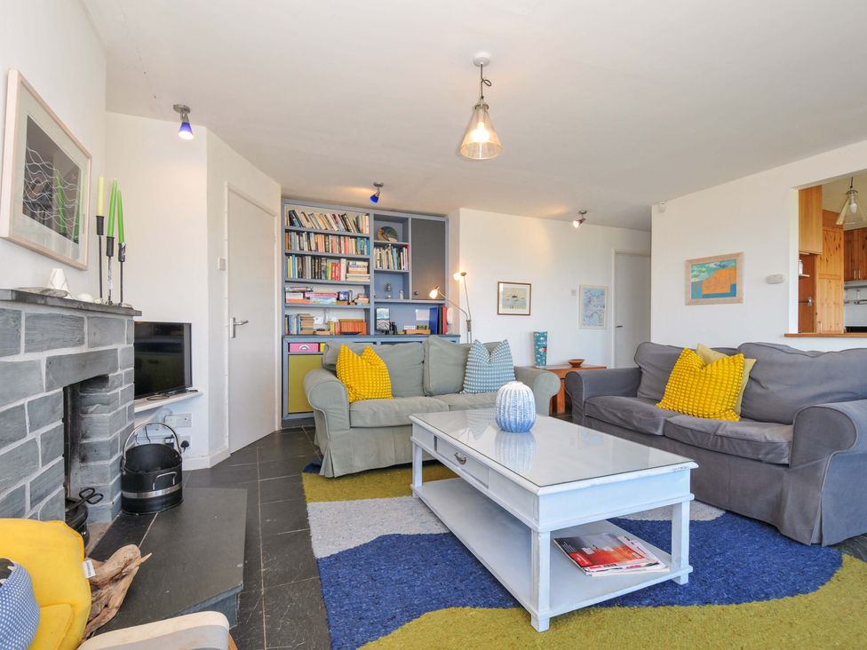 A living room with a sofa and coffee table at Upper Gren in Trebetherick