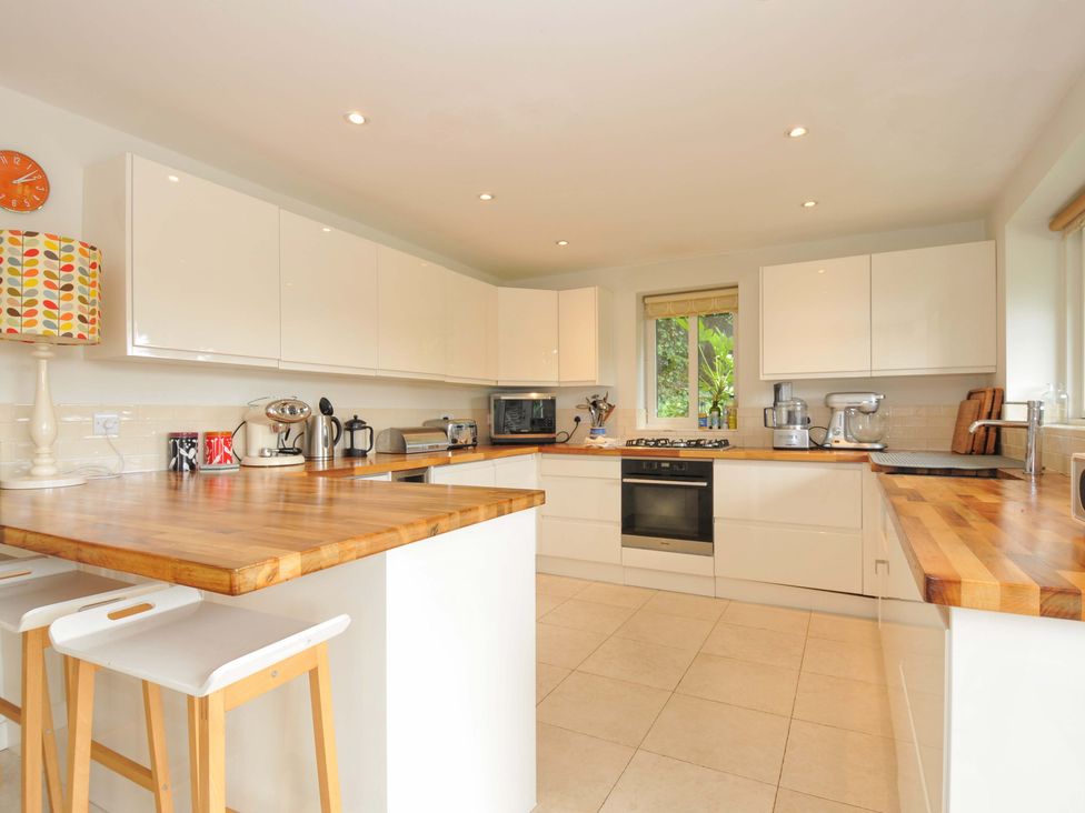 A kitchen with appliances and wooden surfaces at The Old Granary in Rock
