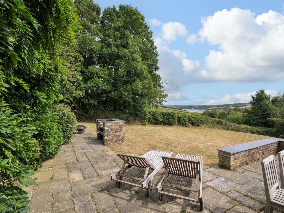 An outdoor area with a patio and grill at The Old Granary in Rock