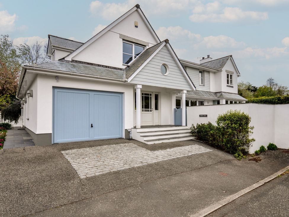 A house with a garage and garden at Cherrytrees in Rock