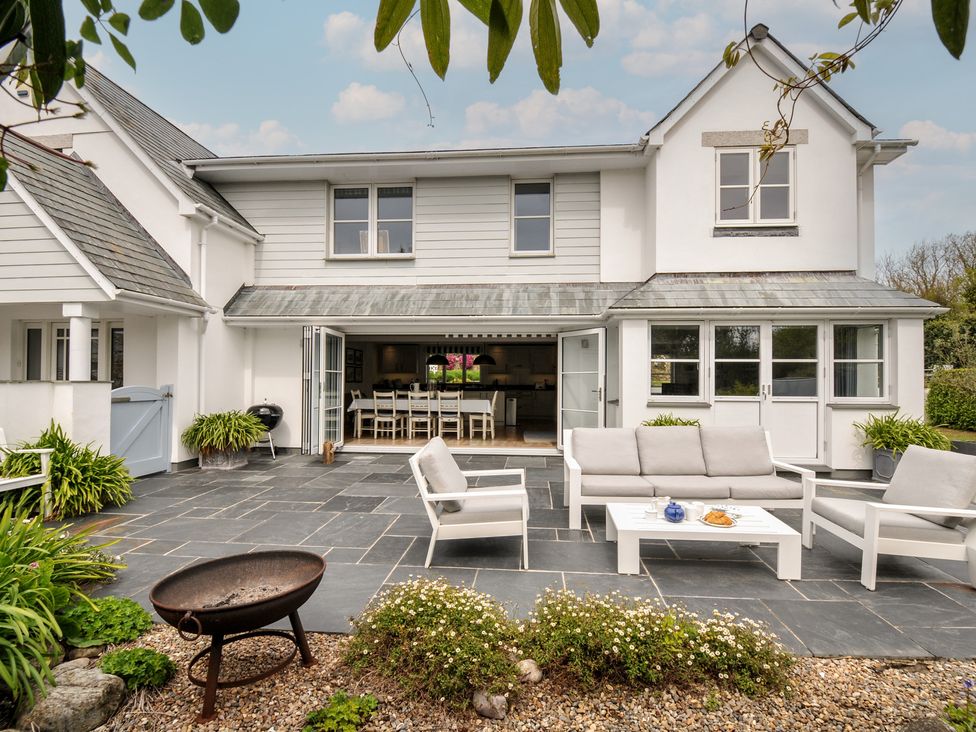A patio with outdoor furniture and a fire pit at Cherrytrees in Rock