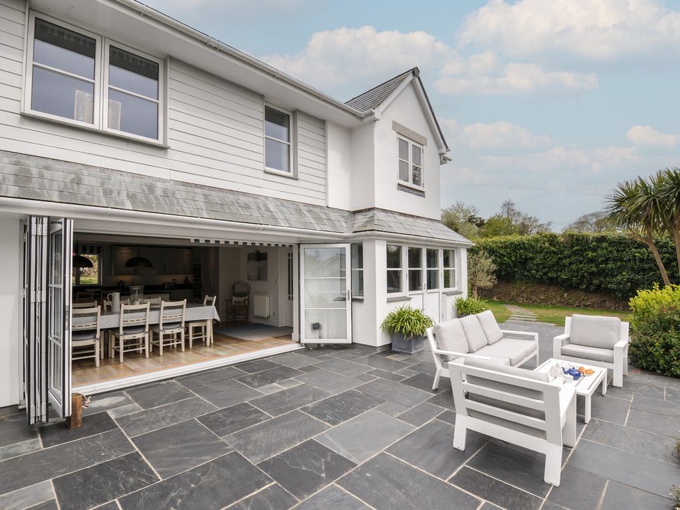 A patio with seating and a table at Cherrytrees in Rock