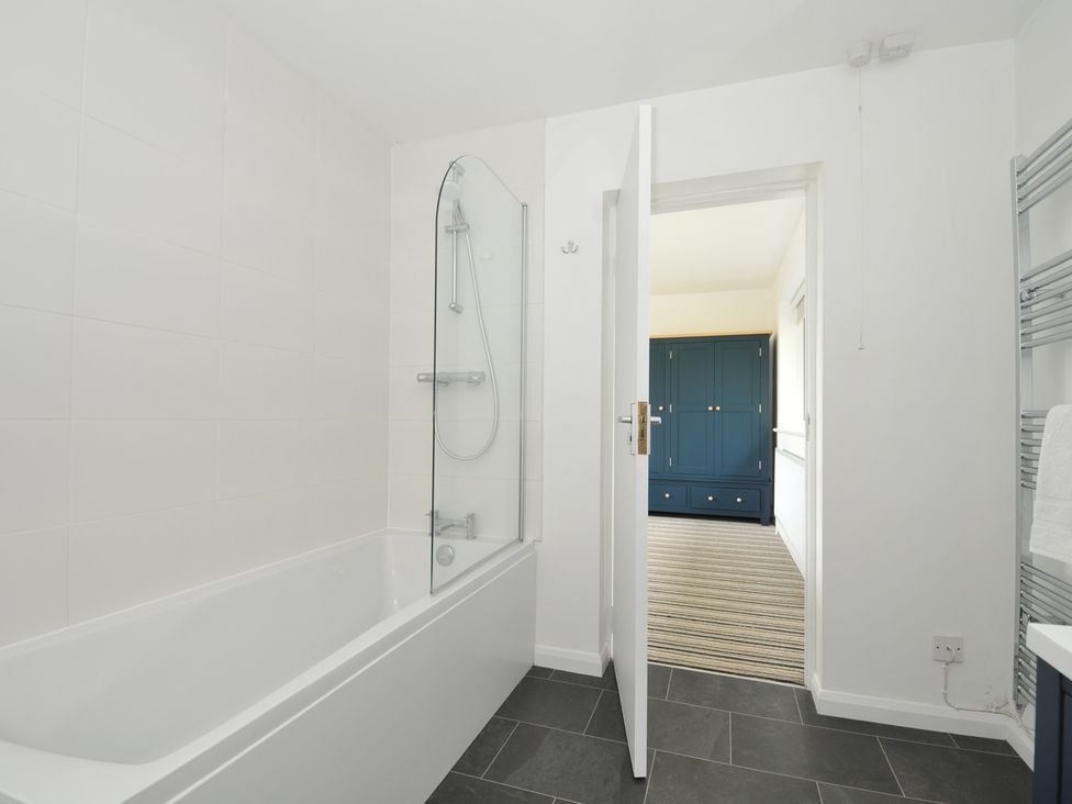 A bathroom with a bathtub and shower at Corriana in Rock