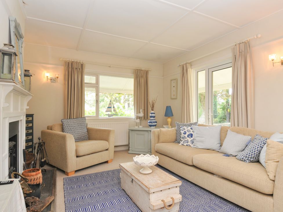 A living room with a sofa and armchair at Sandy Lodge Rock