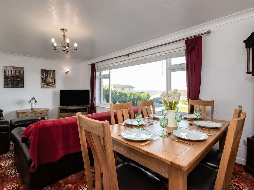 A dining room with a table set for dinner at Hillview Polzeath