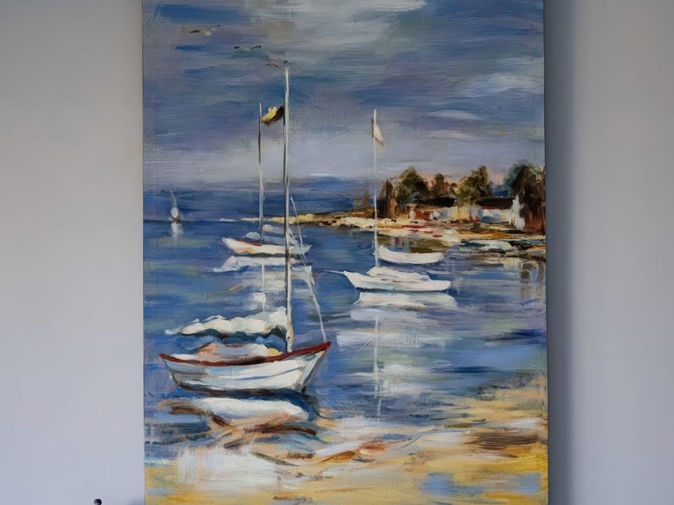 A painting of boats on water at Hillview in Polzeath