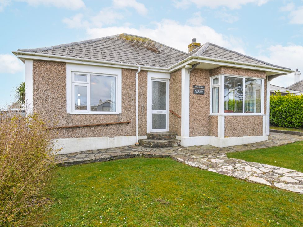 A bungalow with windows and garden at Hillcroft Bungalow Daymer Bay