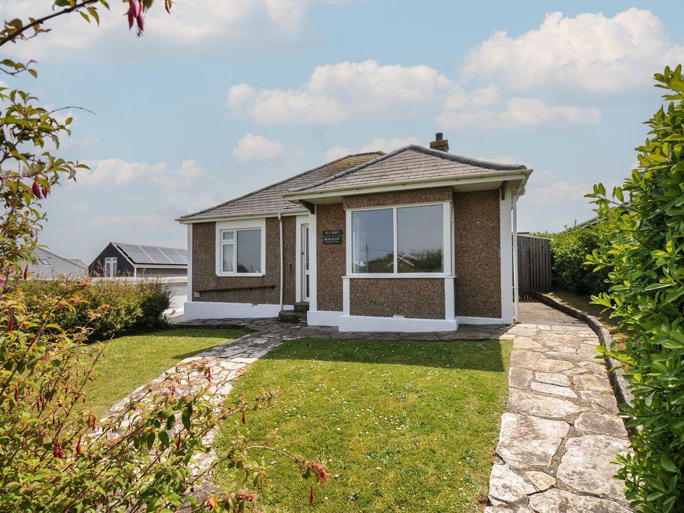 A house with a garden and pathway at Hillcroft Bungalow Daymer Bay
