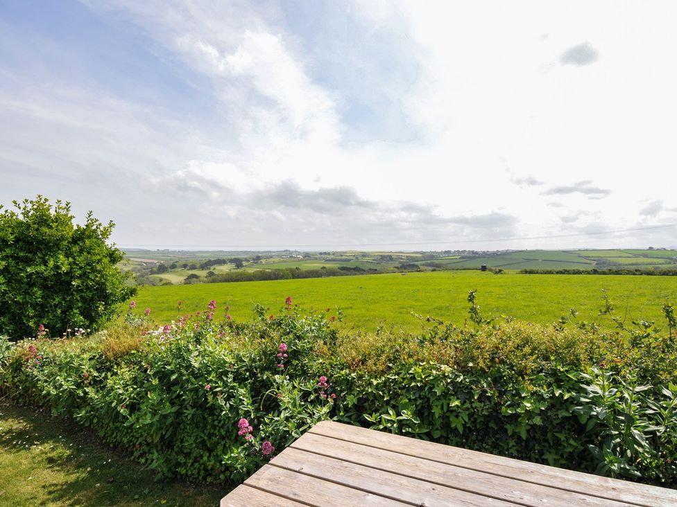 A view of green fields and flowers at Hillcroft Bungalow Daymer Bay