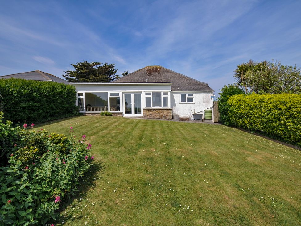 A house with a garden and lawn at Hillcroft Bungalow Daymer Bay