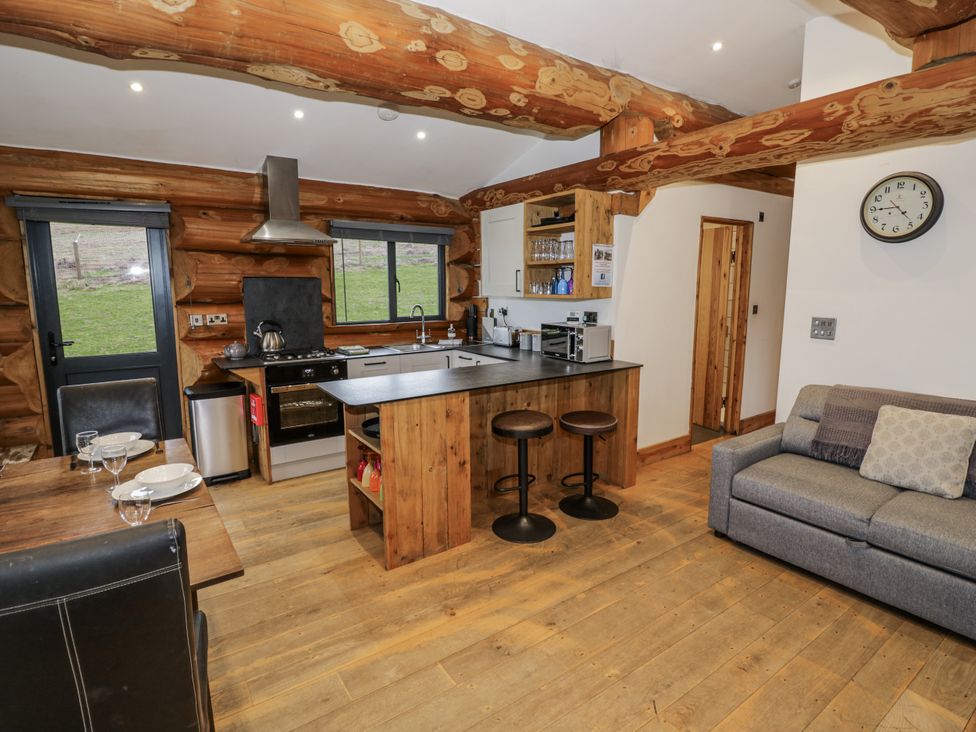 A kitchen with a countertop and dining area at Douglas Cabin at Salford Court Farm Fishing Cabins Near Clifton Upon Teme
