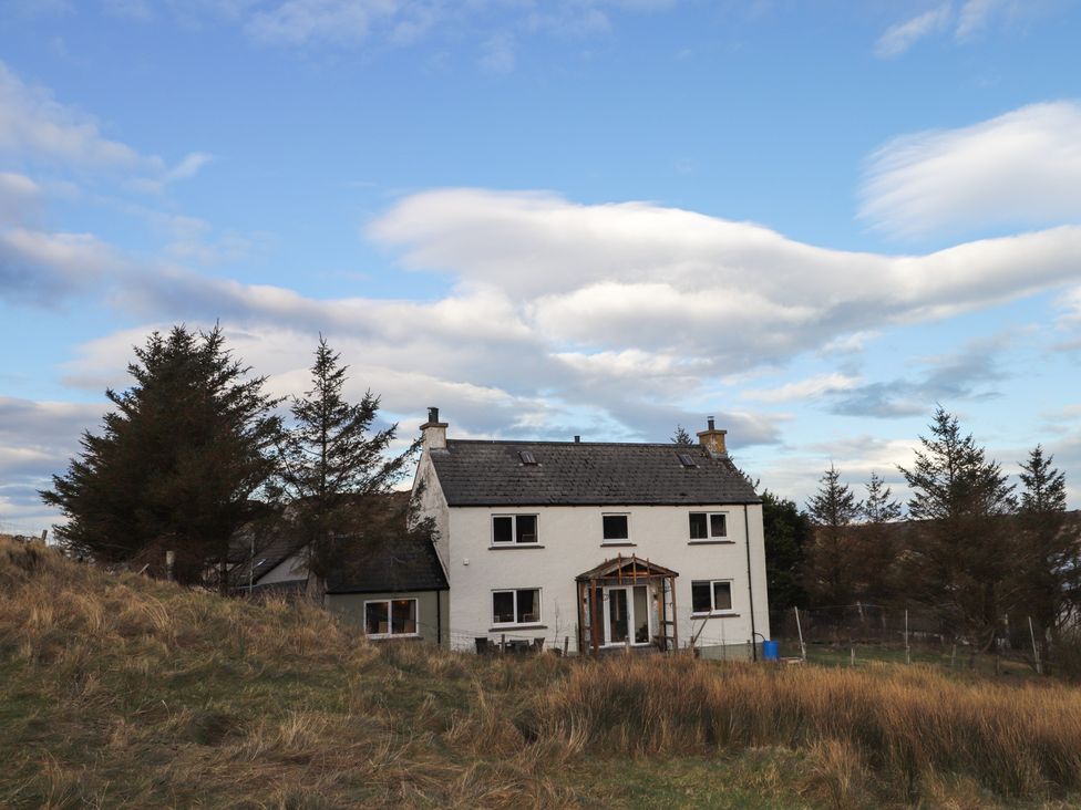 A house surrounded by grass and trees at Free Presbyterian Manse in Kinlochbervie