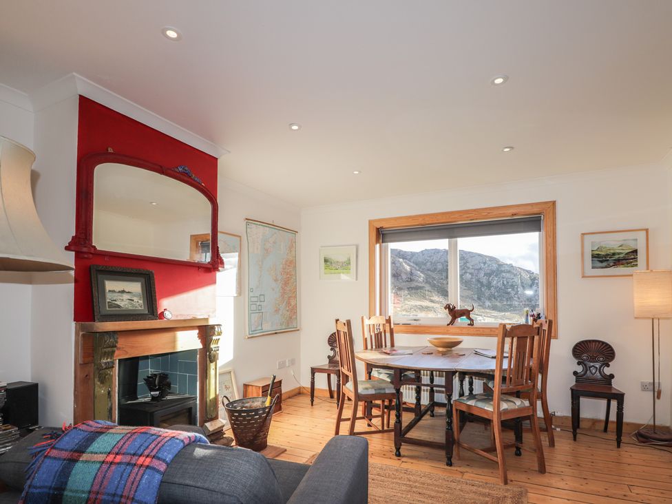 A dining room with a table and chairs at Free Presbyterian Manse in Kinlochbervie