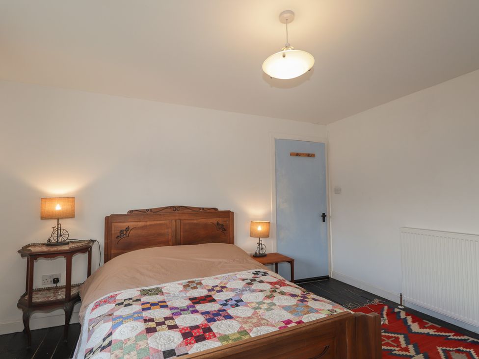 A bedroom with a bed and lamps at Free Presbyterian Manse in Kinlochbervie