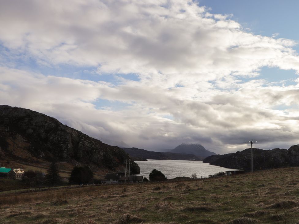 A landscape with mountains and water at Free Presbyterian Manse in Kinlochbervie