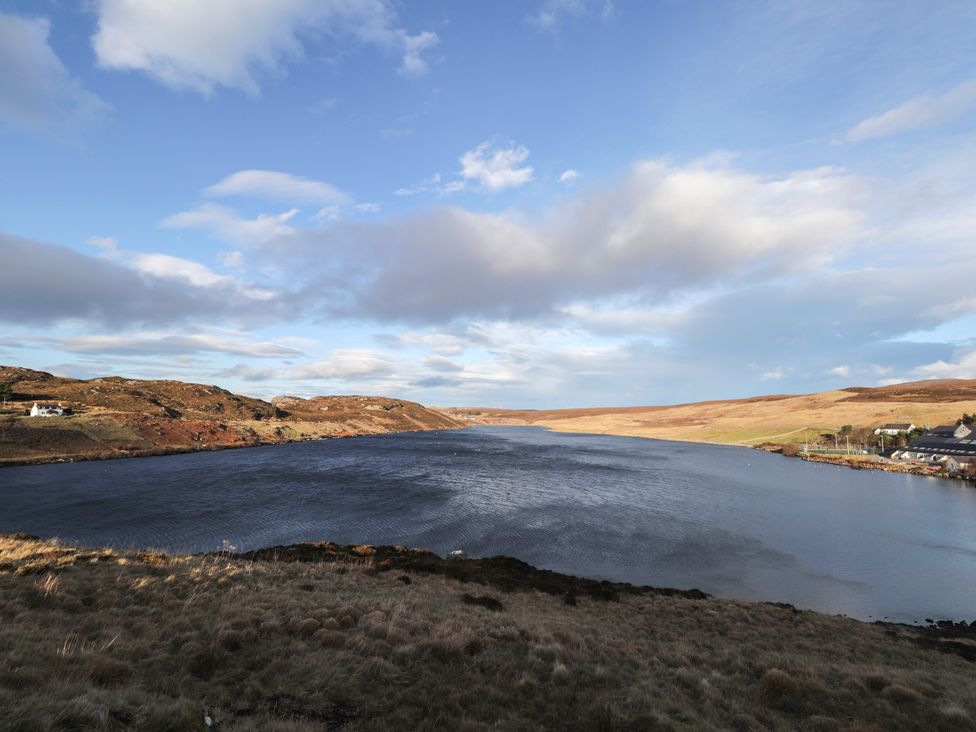 A view of water and land with buildings at Free Presbyterian Manse in Kinlochbervie