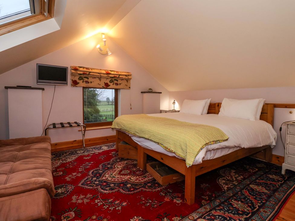 A bedroom with a bed and TV at Brush and Boot in York