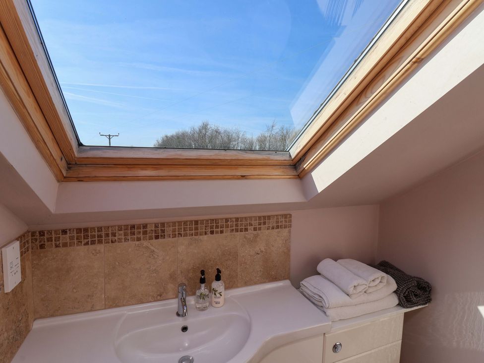 A bathroom with a sink and towels at Brush and Boot in Stittenham near York