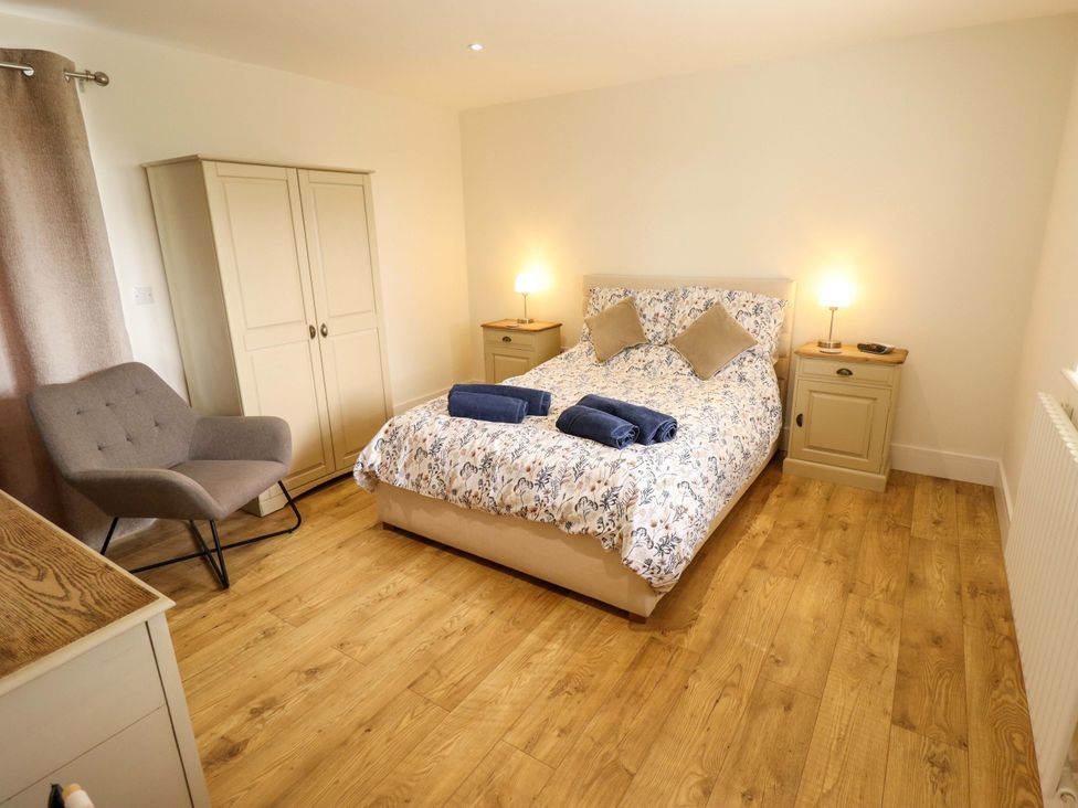 A bedroom with a double bed and bedside tables at The New Build South Reston near Louth