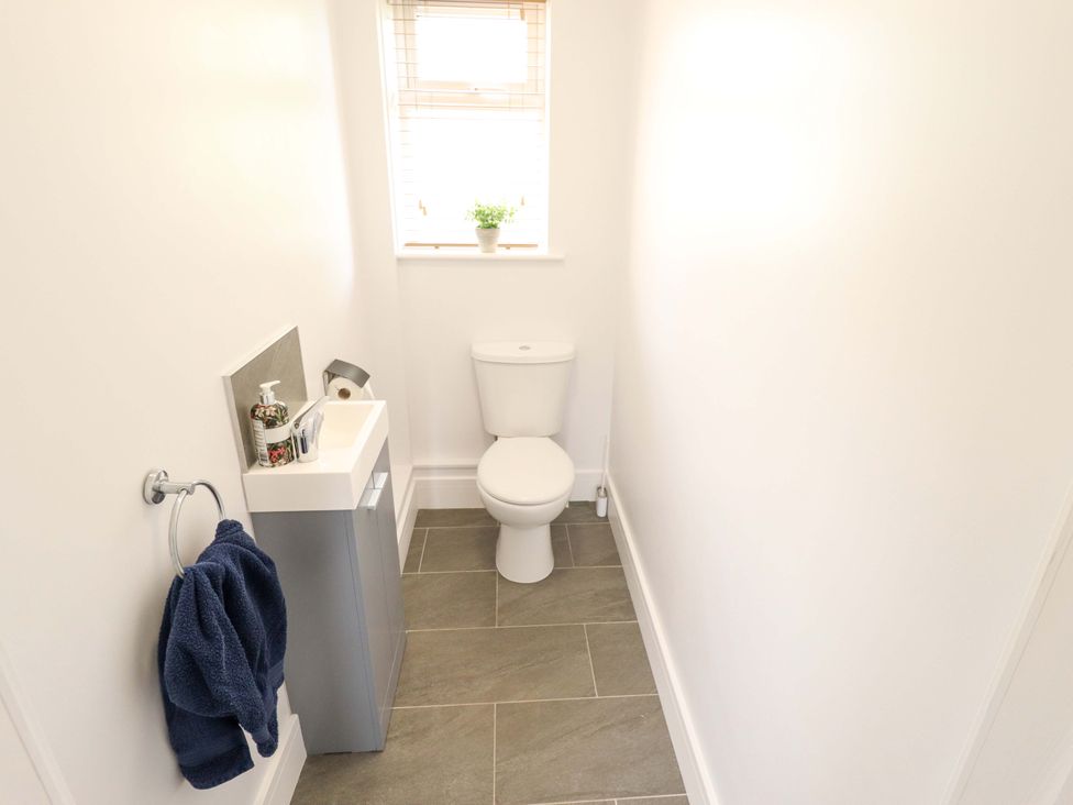 A bathroom with a toilet and sink at The New Build in South Reston near Louth