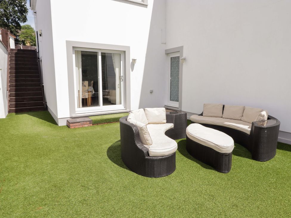 An outdoor area with seating and steps at Charlecote House in Saundersfoot