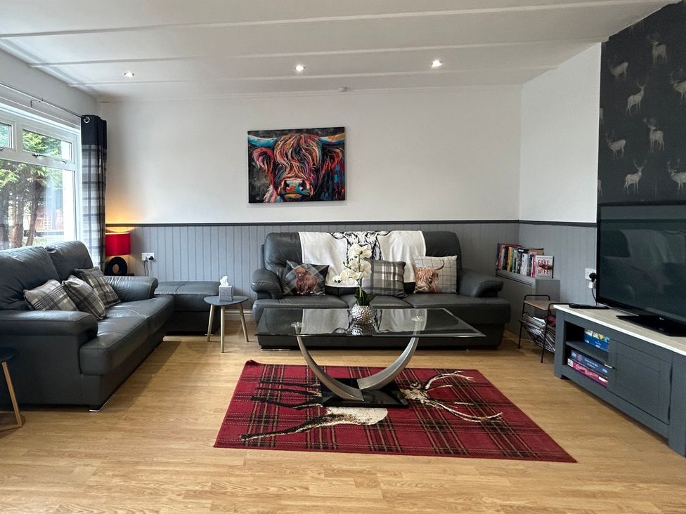 A living room with sofas and a coffee table at Solway Cottage Powfoot near Annan