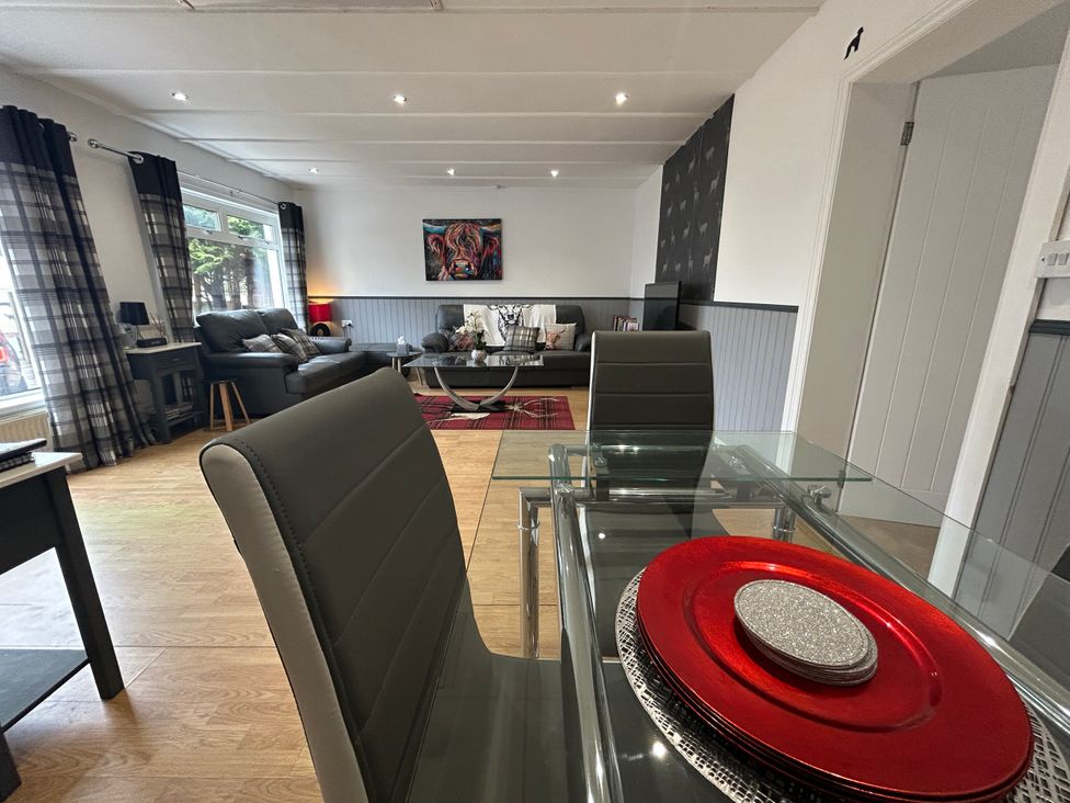 A living room with a sofa and coffee table at Solway Cottage in Powfoot near Annan