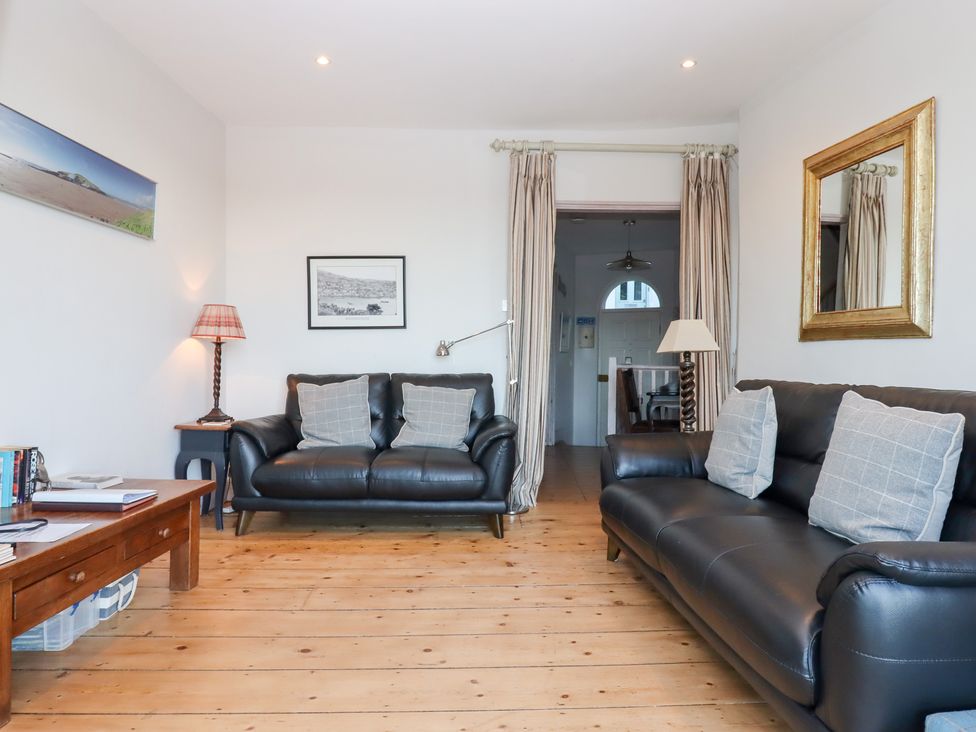 A living room with sofas and a lamp at 13 Above Town in Dartmouth
