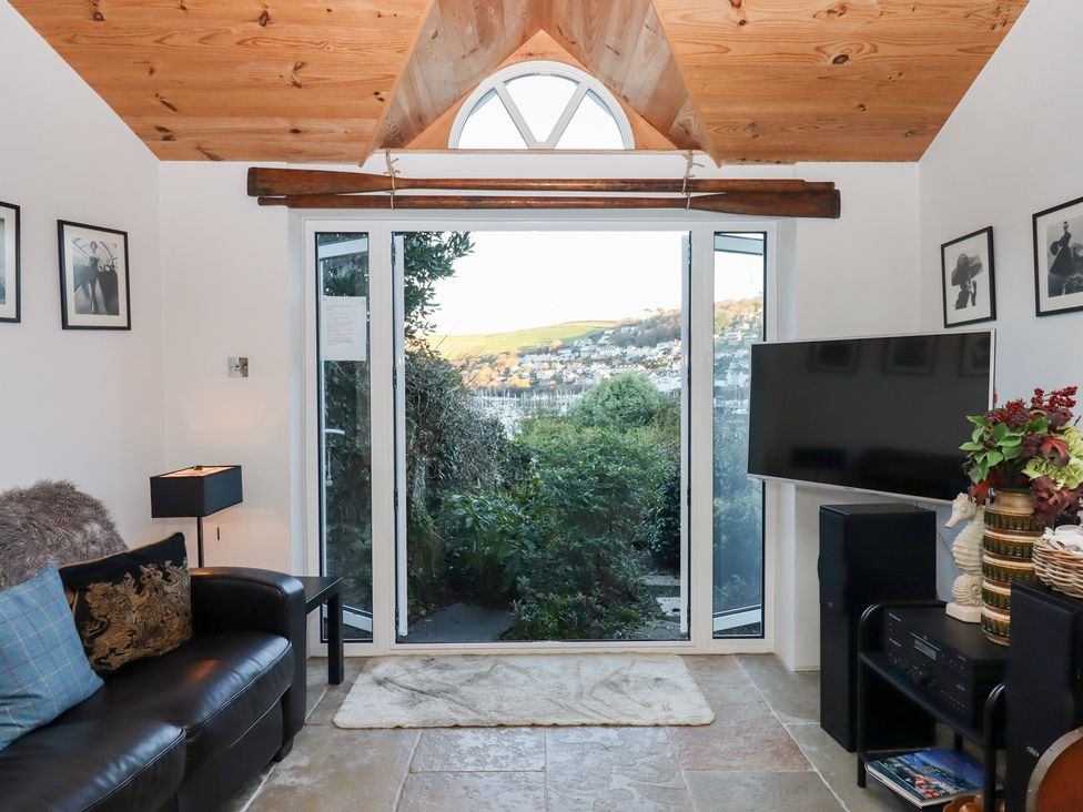 A snug with a sofa and television at 13 Above Town in Dartmouth