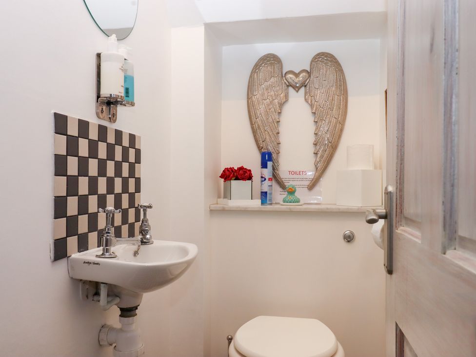A bathroom with a sink and toilet at 13 Above Town in Dartmouth