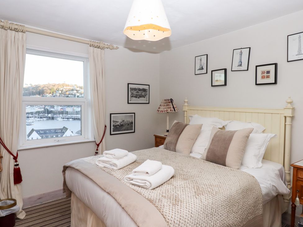 A bedroom with a bed and a window view at 13 Above Town in Dartmouth