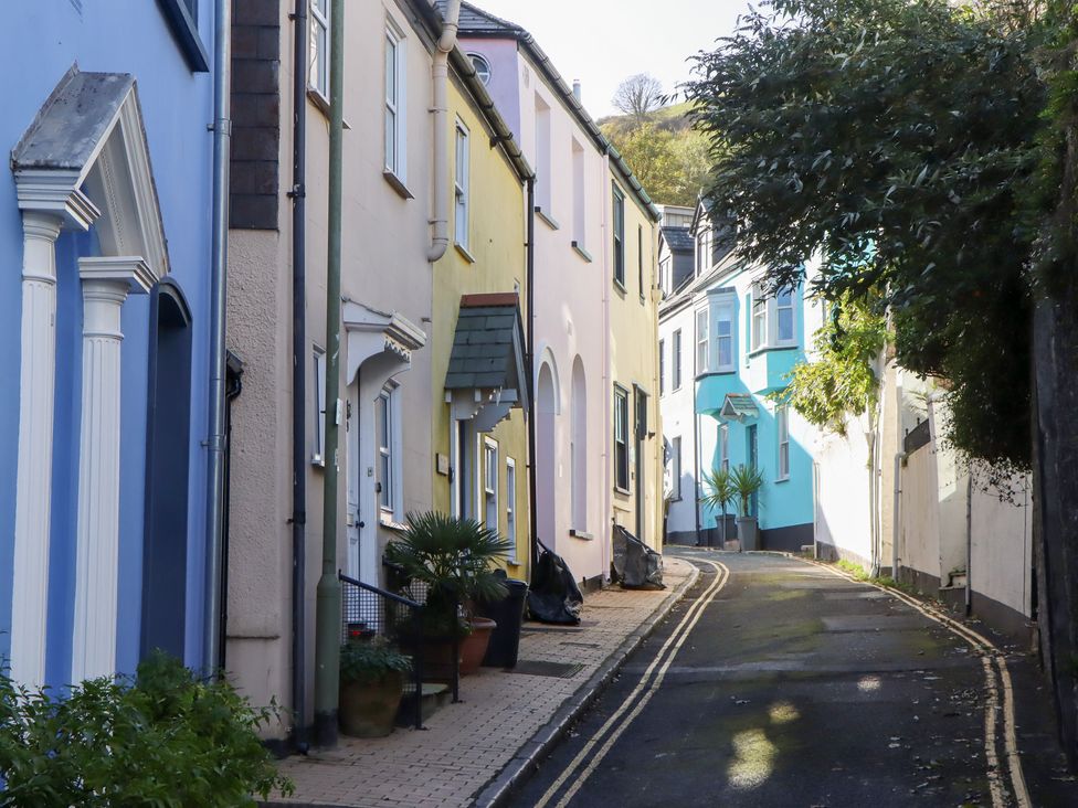 A street with colorful houses and a road in Dartmouth