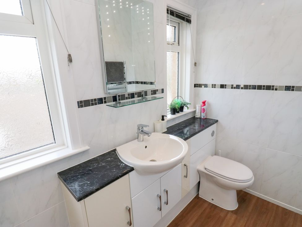 A bathroom with a sink and toilet at Farnhill View Cross Hills